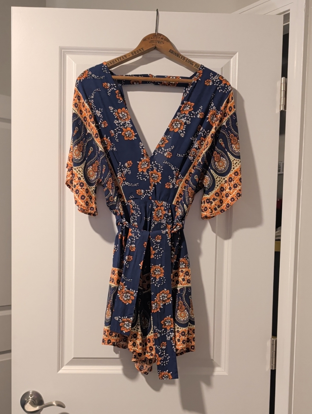 Adorable Floral Navy and Orange Wrap Romper